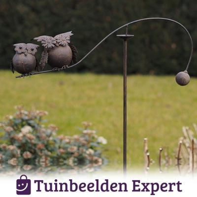 metalen uil met bloemetjesogen